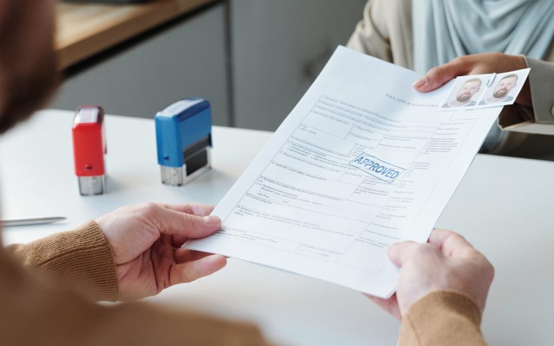 Approving Visa After Interview At Table Approving Visa After Interview At Table